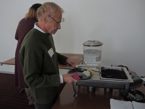 Professor Jim Scheibel serves up a portion of rice and beans.