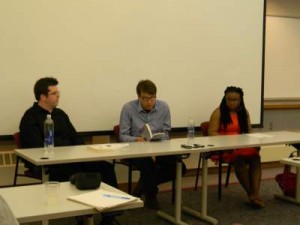 Author Kevin Moffett reads an excerpt from his story “Tattooizm” during an interview on Wednesday, April 15. Two Hamline students, Paul Patane (‘16) and Deziree Brown (‘15), conducted the interview. 