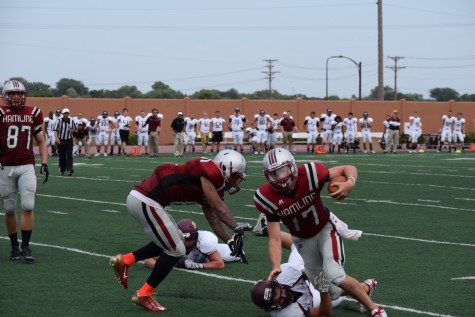 Sophomore quarterback Kyle Johnson rushes for the first down marker on Saturday, Sep. 5.